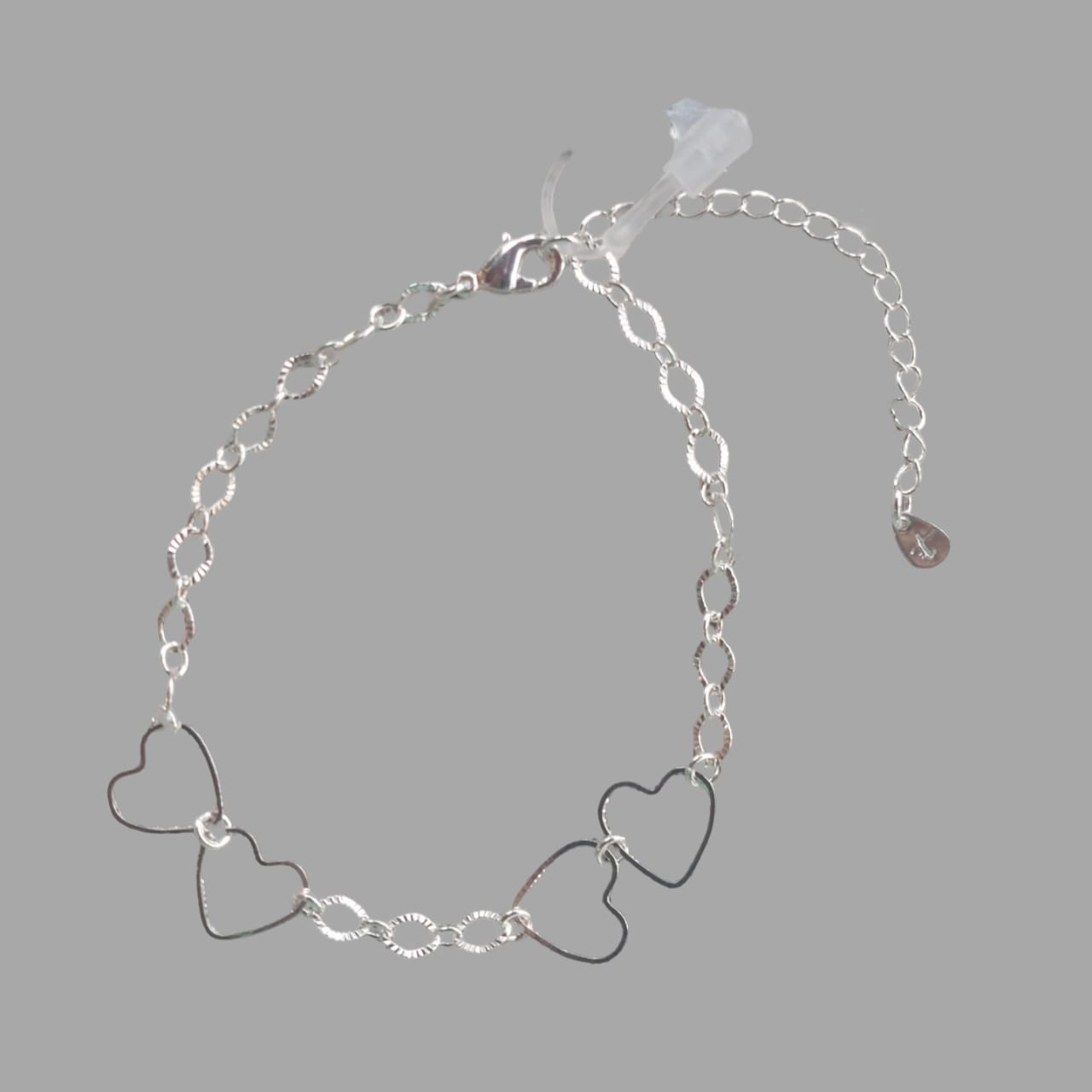 PULSEIRA ELO OVAL DIAMANTADO C/ 4 CORAÇÕES VAZADOS